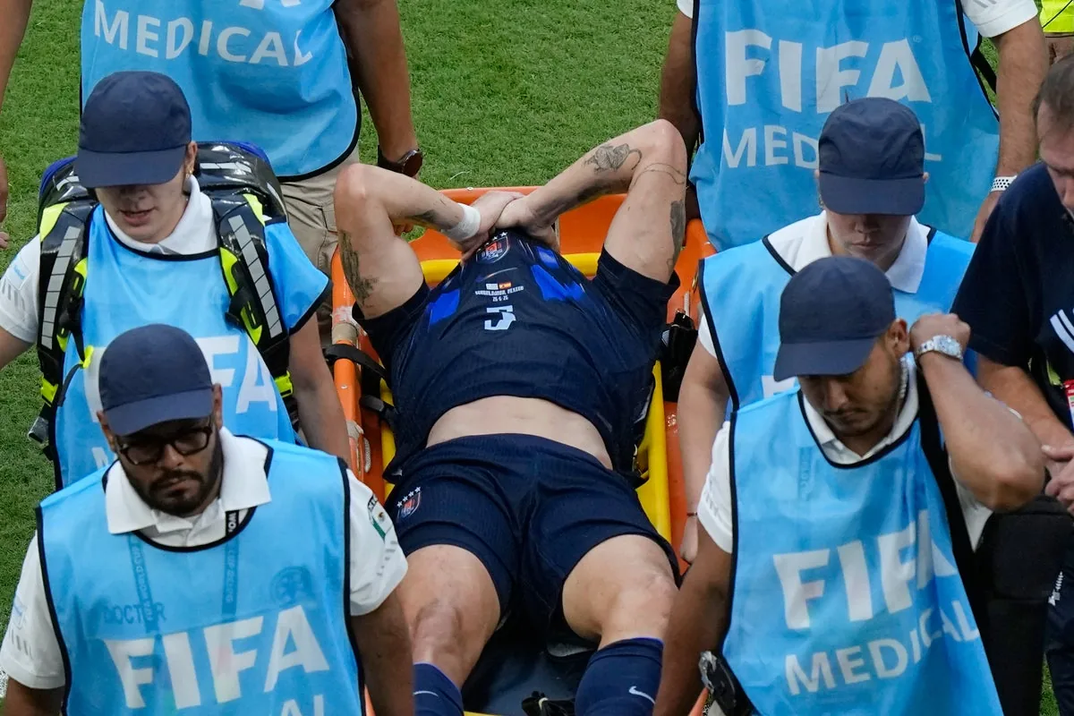 Uruguay midfielder Manuel Ugarte stretchered off in World Cup exit image 1