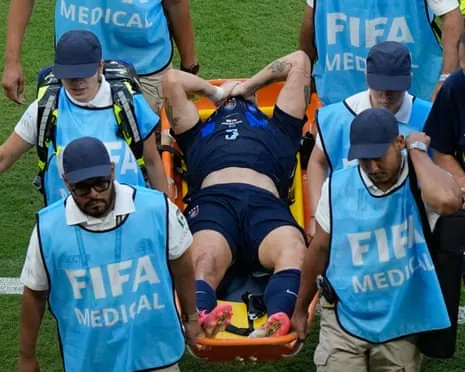 Uruguay’s Manuel Ugarte is carried off the pitch after sustaining a serious knee injury against Spain