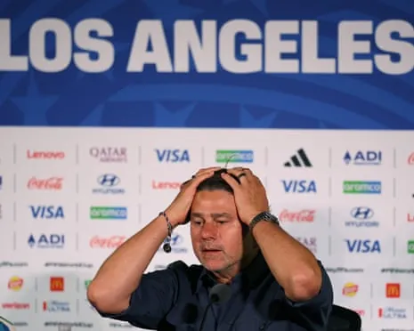 Mauricio Pochettino puts his hands on his head as he addresses the media after the US lost to Turkey.