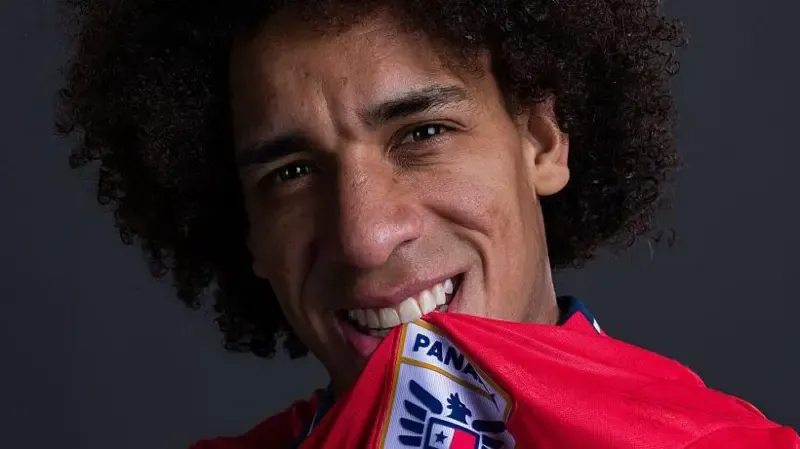 Adalberto Carrasquilla has the Panama shirt and crest in his mouth as he poses for a portrait prior to the World Cup