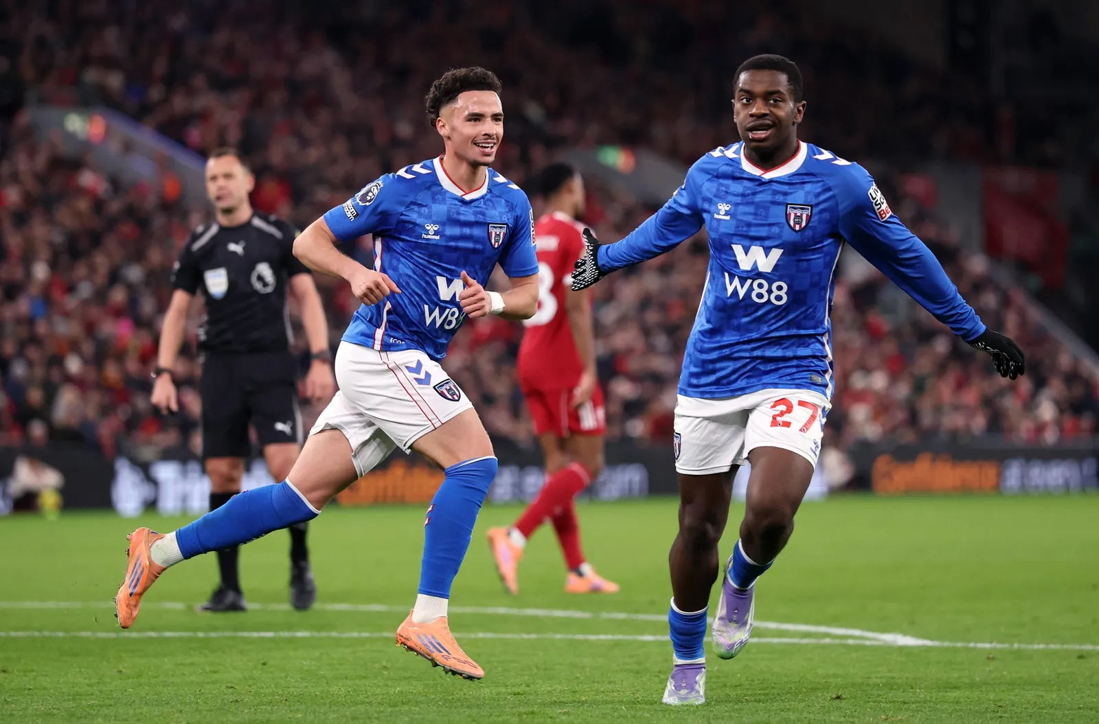 LIVERPOOL, ENGLAND - DECEMBER 03: Chemsdine Talbi of Sunderland celebrates scoring his team’s first goal with teammate Noah Sadiki during the Premier League match between Liverpool and Sunderland at Anfield on December 03, 2025 in Liverpool, England. (Photo by Carl Recine/Getty Images)