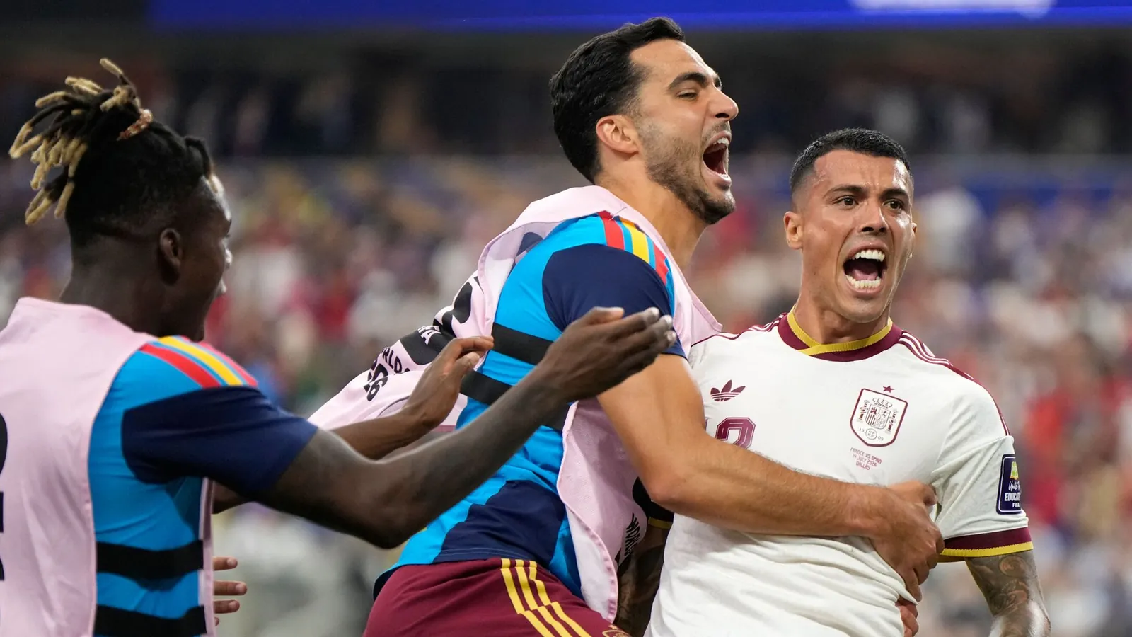 Spain's Pedro Porro, right, celebrates with Mikel Merino and Nico Williams