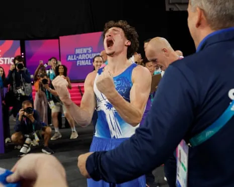 Scotland’s Reuben Ward celebrates his win after competing in the men's all-around final.