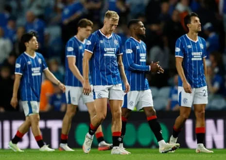 Ross McCrorie (centre) and his Rangers teammates trudge off the field after the match