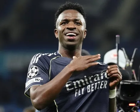 Vinícius Júnior celebrates after a Real Madrid victory in a Champions League match in March